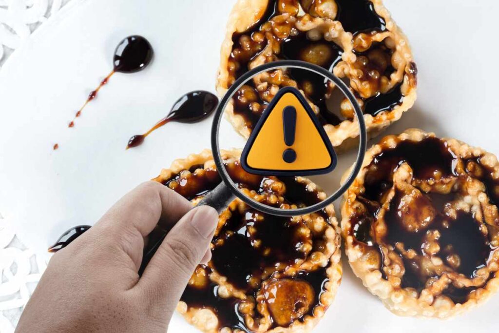 cartellate al vincotto, con lente d'ingrandimento che evidenzia un pericolo